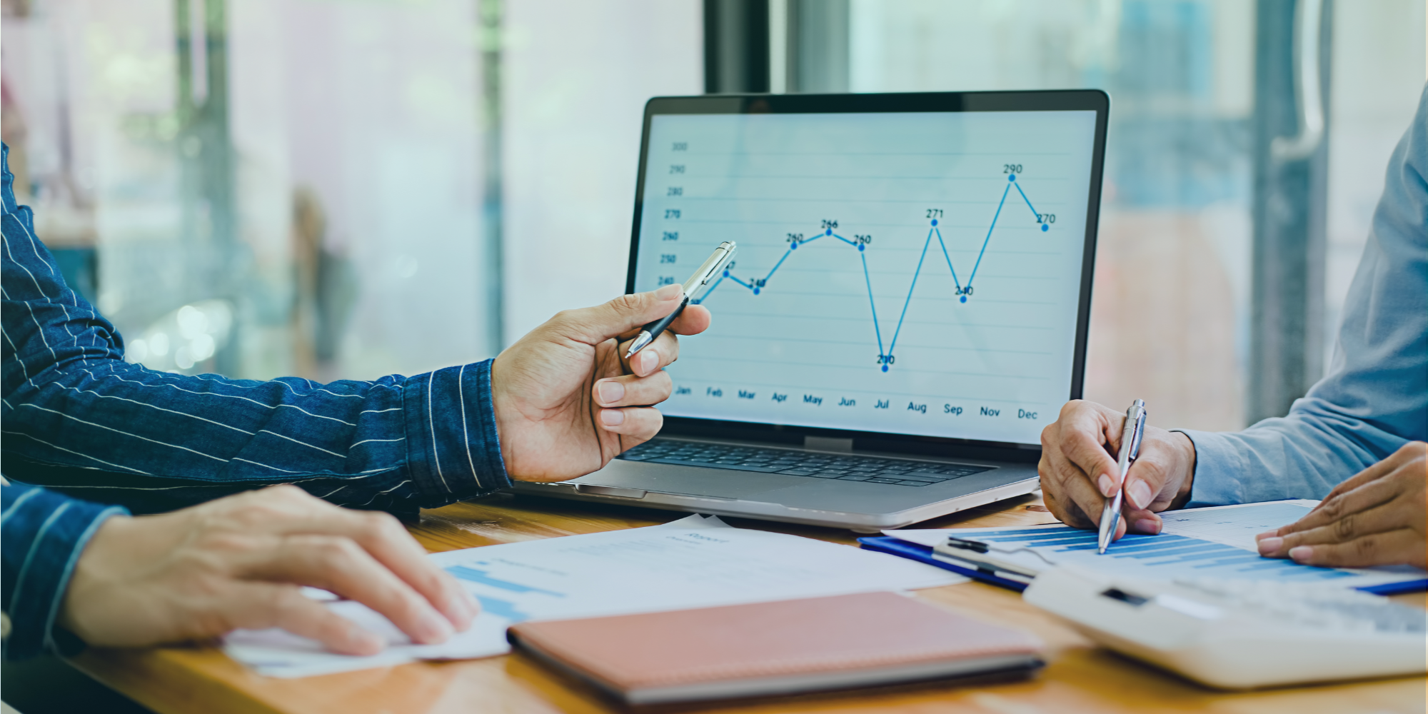 banner image with a line graph of survey metrics on a screen